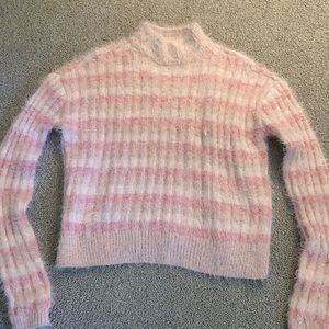 Fluffy pink candies sweater with high neck. Size small. Never worn but no tags.